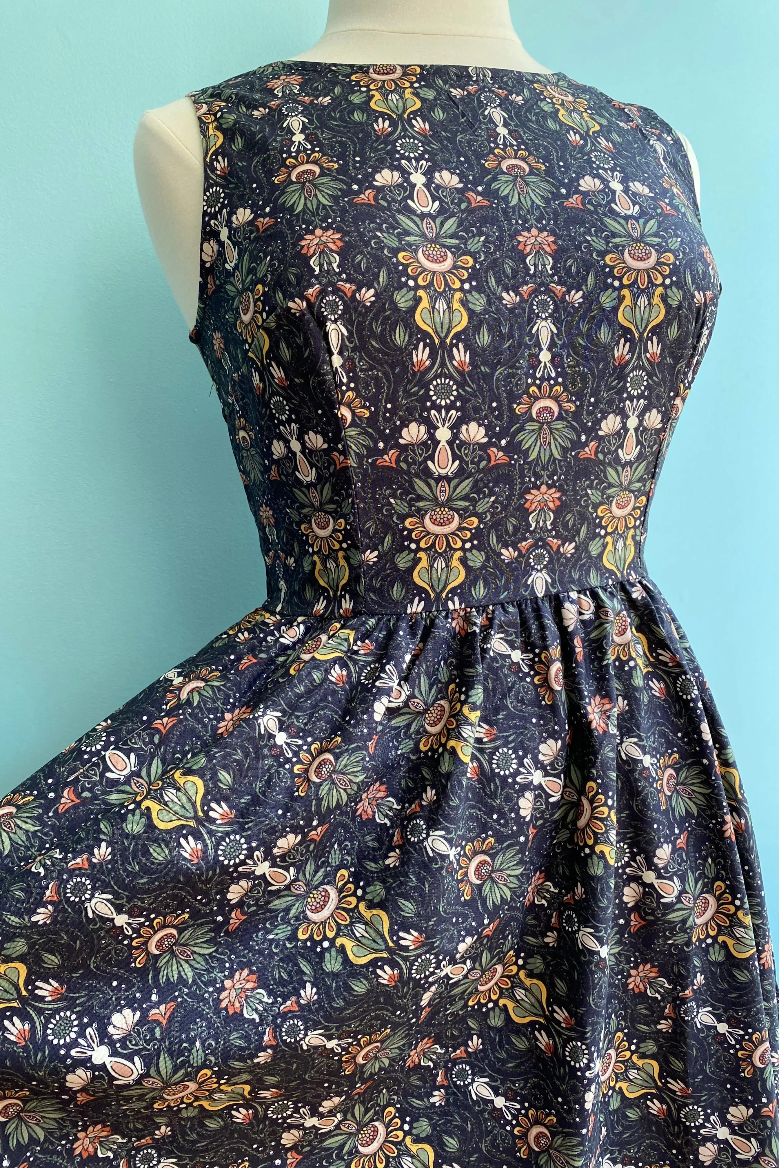 Folk Art Floral & Bunny Midi Dress in Navy by Retrolicious